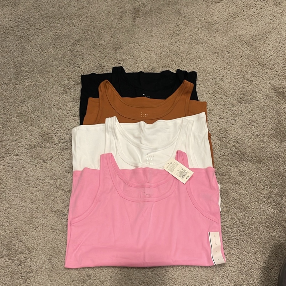 A New Day Tank Tops